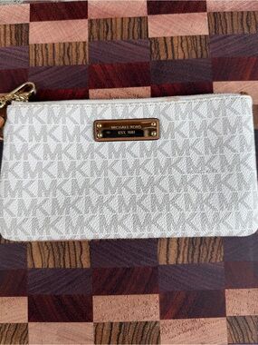 Michael Kors Ivory Logo Wristlet with Gold Plate